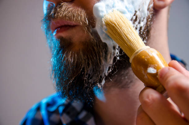 istock man putting shaving cream with brush 1156489482