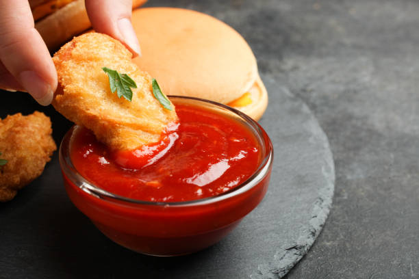 istock Nuggets, two cheeseburgers and chili sauce 1156491431