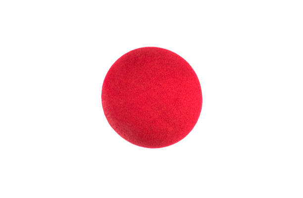 istock Red Nose Day, red clown nose on white background 1156493941