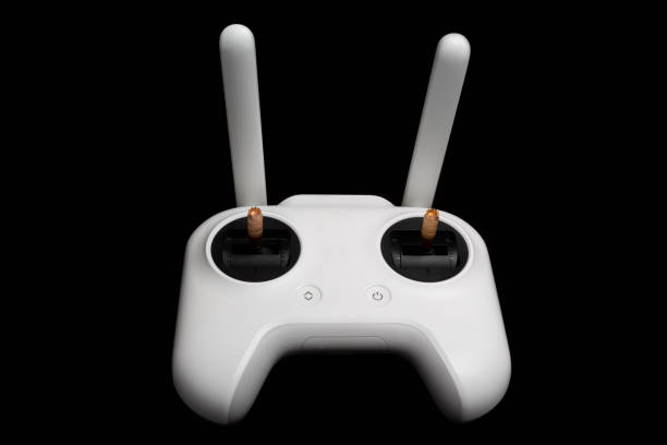 istock White wireless control panel for the drone. Joystick for copter. Isolated on a black background. Front view 1156494085