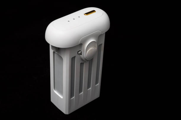 istock White battery for drone close-up on a black background. Isolated 1156494089
