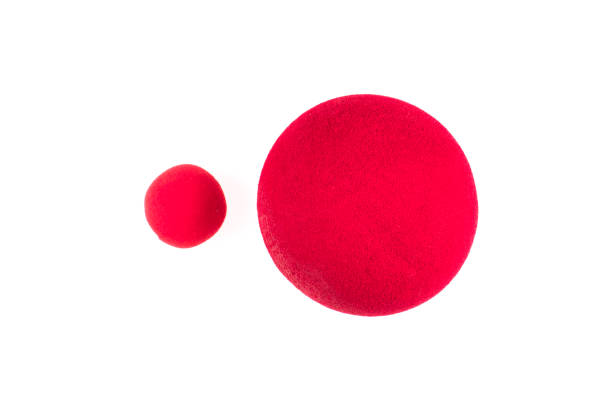 istock Red Nose Day, red clown nose on white background 1156494205
