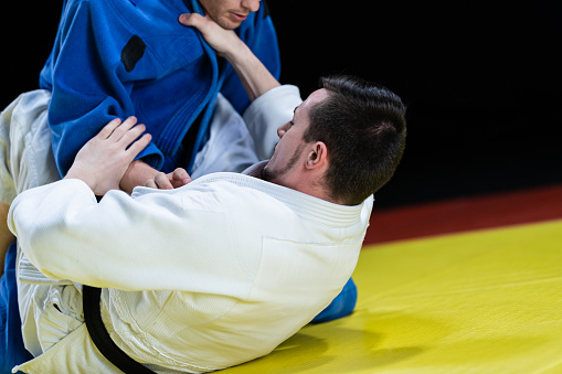 Male Judo Players Competing During Match