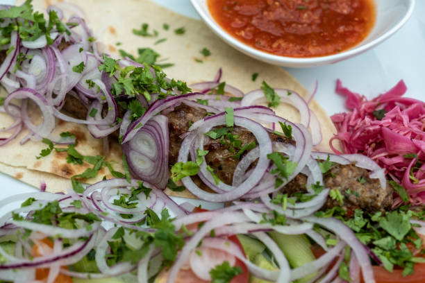 istock fried meat with fresh onions on a plate, lula kebab from lamb 1156498929