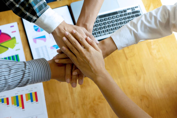 istock businessman hand together with another business 1156499501