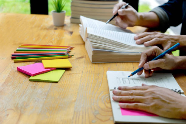 istock woman and man work on the table 1156499680