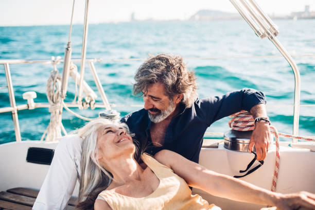 istock Man and woman sunbathing 1156500880