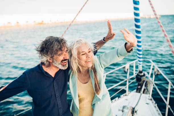 istock Happy couple waving hands 1156501468