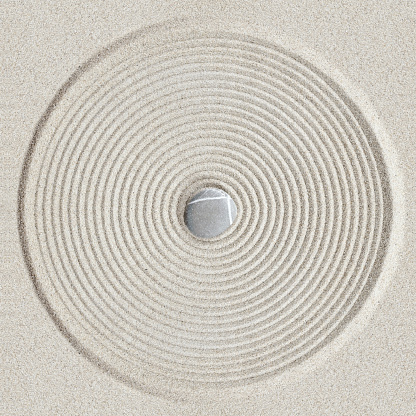 Zen circle pattern on sand background
