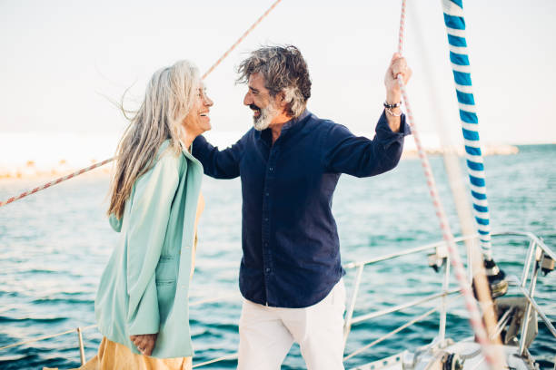 istock Man and woman sailing together 1156502131