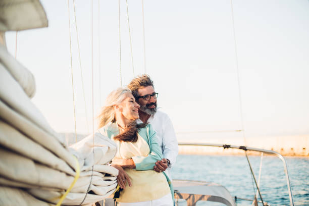 istock Senior couple hugging on a yacht 1156502167