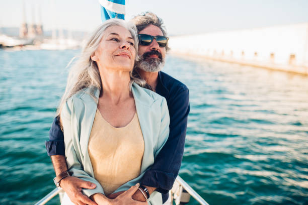istock Older couple hugging on a boat 1156502280