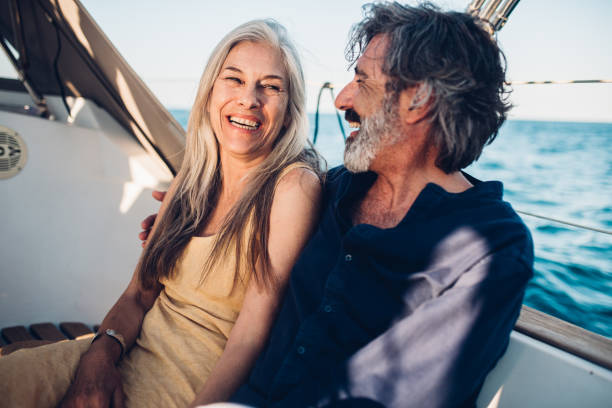 istock Couple smiling when sitting on a boat 1156502390