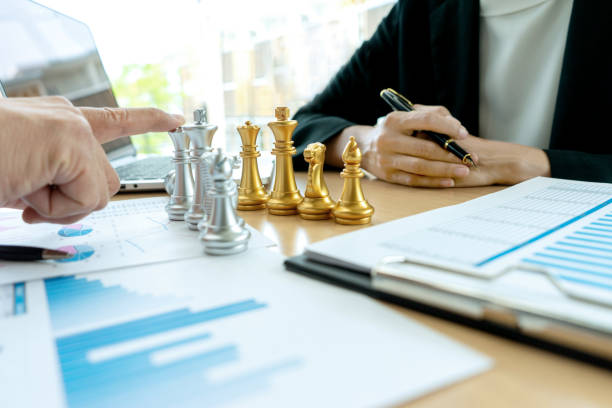istock Businessman play chess on the marketing work place 1156502446