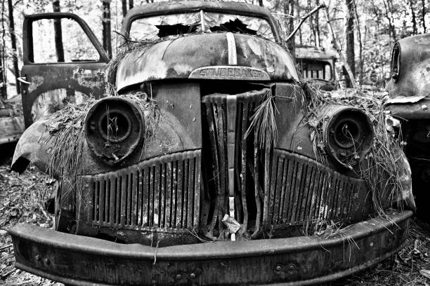 Old Scrap Studebaker Truck White, GA / USA - October 27, 2018 - Close-up Image of the Front of an Old Studebaker Truck in a Junk Yard distressed rusty vintage pickup truck close up detail stock pictures, royalty-free photos & images