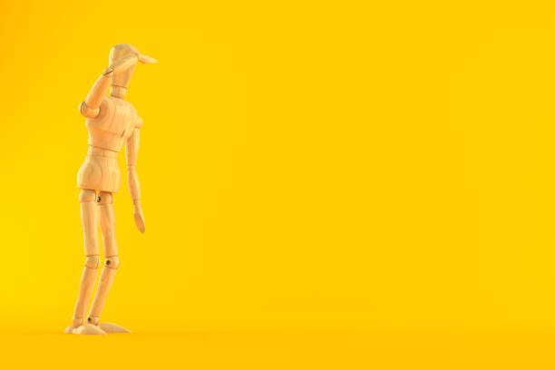 istock Wooden dummy looking for 1156506383
