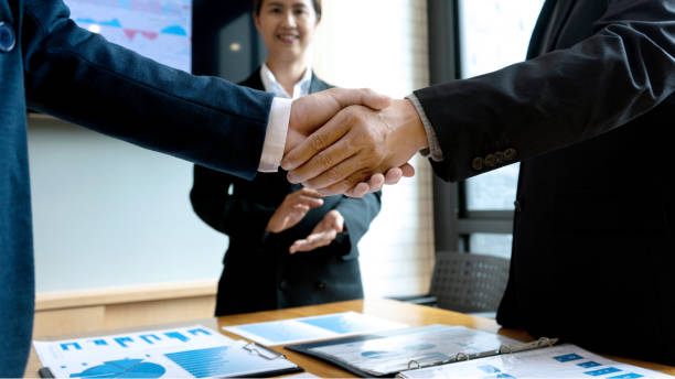 istock Businessman hand together Handshake for business 1156507101