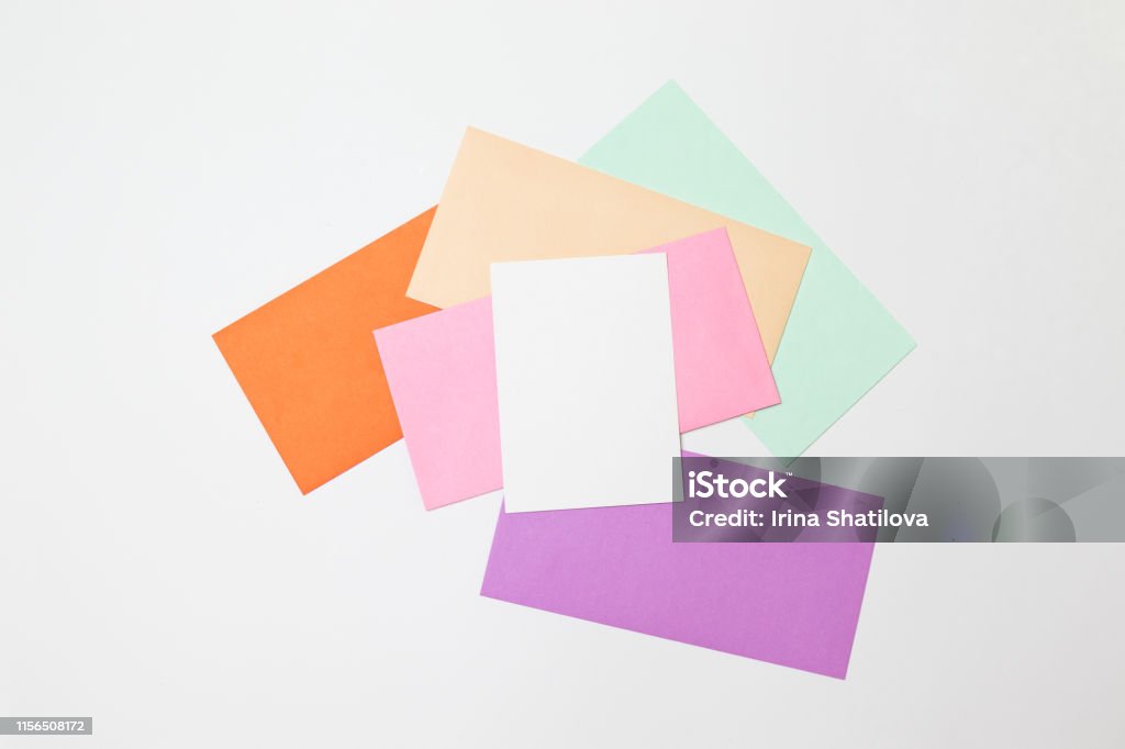 Heap of colorful envelopes on working desk. Mockup for business mail, blogging and office correspondence. Flat lay. Colorful envelopes on working desk. Mockup for business mail, blogging and office correspondence. Flat lay. Above Stock Photo