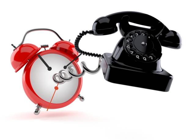 istock Telephone with alarm clock 1156508504