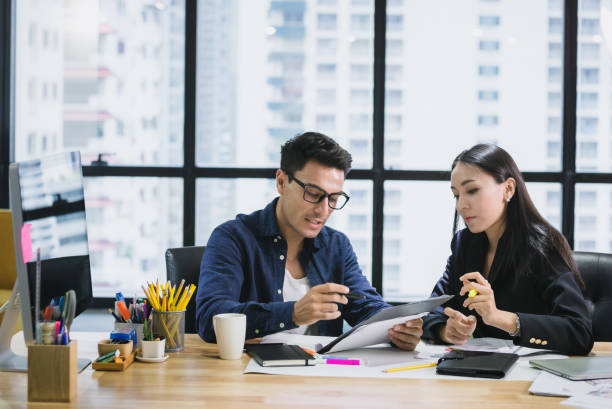 istock Business people with a team talking in office 1156509700