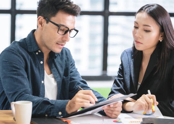 istock Business people with a team talking in office 1156509704