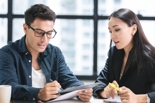 istock Business people with a team talking in office 1156509732