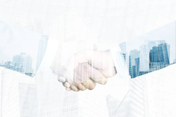 istock Business partnership handshake concept.Businessmans handshaking with double exposure 1156509913