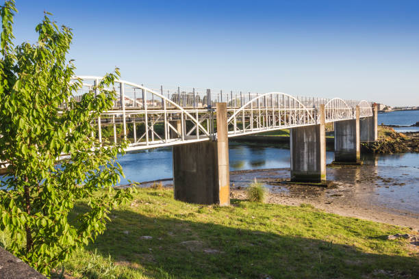 istock Pedestrian bridge on Te river mouth 1156511580