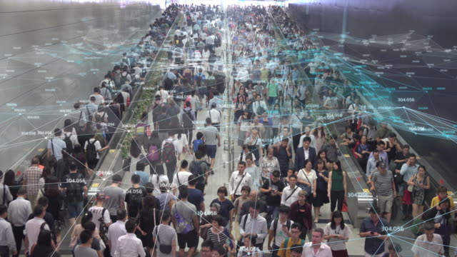 4K resolution networking Connection and communication Concept with Crowd commuters of pedestrian commuters on train station at Hong Kong station.Internet of Thing and Big data concept