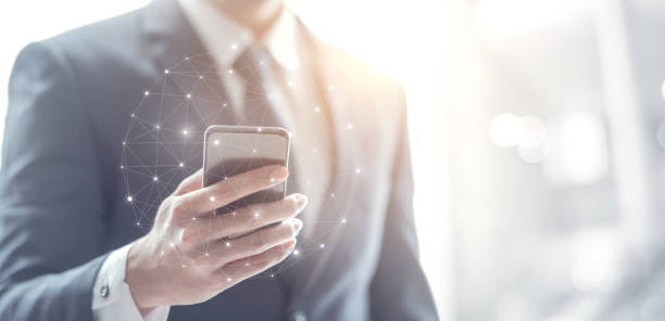 istock Social networking connection concept, Businessman hand using mobile phone and dots online communication network. 1156512580