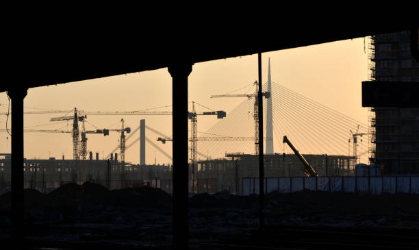 istock Cranes on the building site in the sunset 1156515081