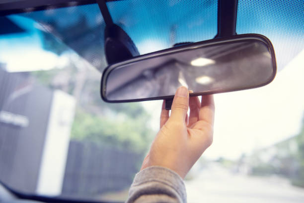 istock Close up Hand adjusting rear view mirror. Safety concept. 1156515793