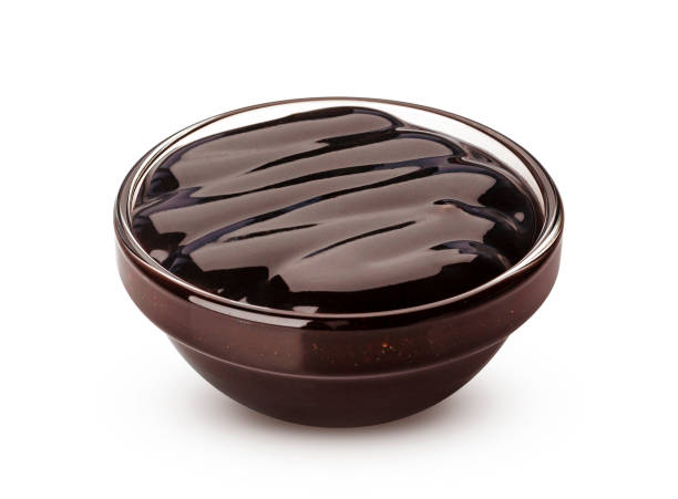 istock Sweet chocolate sauce isolated on white background 1156518516