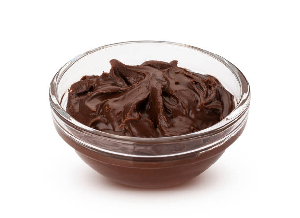 istock Chocolate hazelnut cream in glass bowl, isolated on white background 1156518563