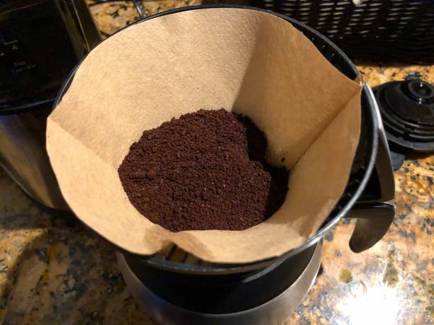 istock Making morning coffee in coffee pot - coffee filter 1156519374
