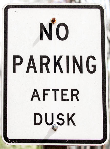 istock Grungy Sign -- NO Parking After Dusk 1156521015