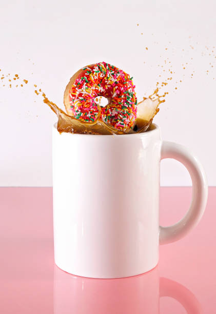 Donut Splashing in a Giant Cup of Black Coffee