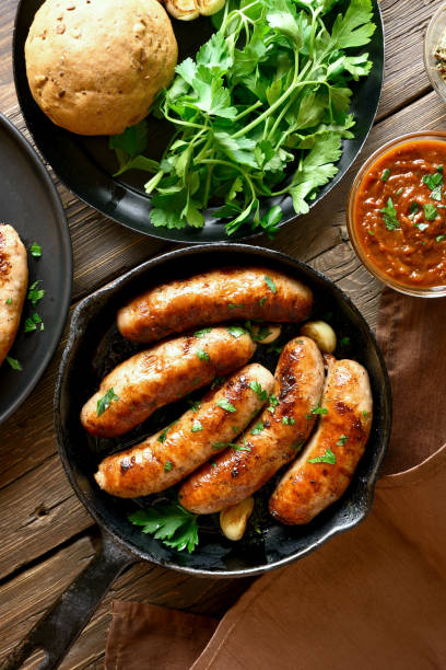 istock Fried sausages in frying pan 1156521369