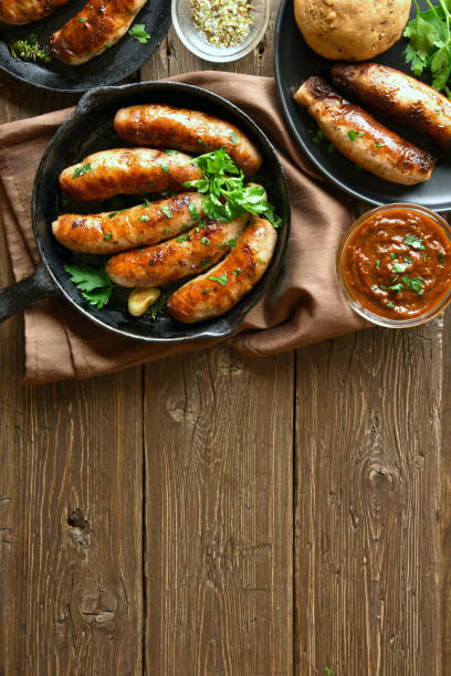 istock Fried sausages in frying pan 1156521370