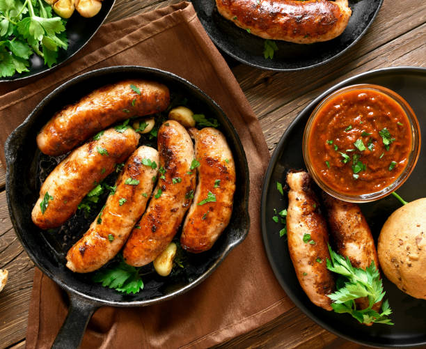 istock Fried sausages in frying pan 1156521400