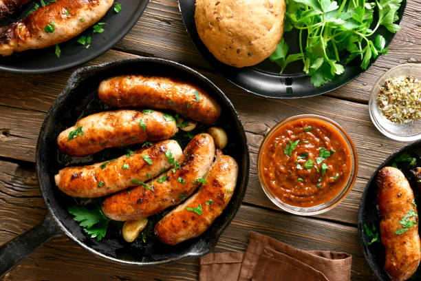 istock Fried sausages in frying pan 1156521411