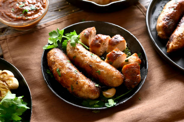 istock Fried sausages in frying pan 1156521459