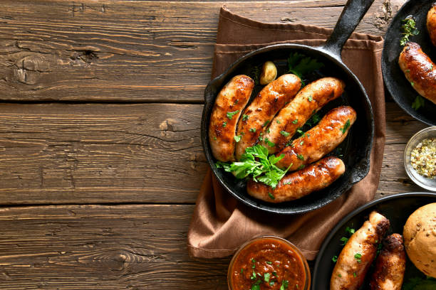 istock Fried sausages in frying pan 1156521461