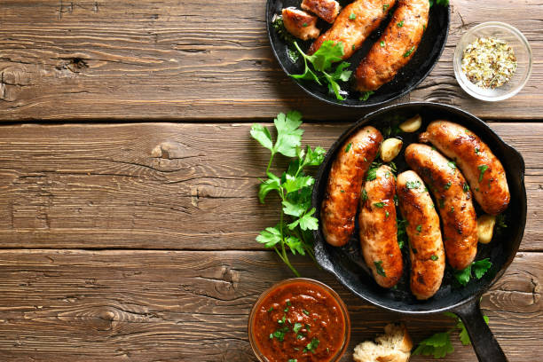 istock Fried sausages in frying pan 1156521464