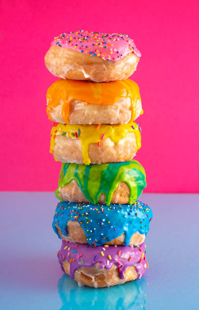 istock A Tower of Rainbow Colored Glazed Donuts 1156522099