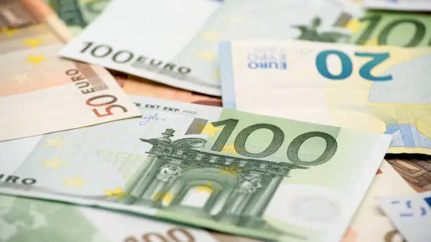 Euros bills of different values. A euro bill of one hundred. Cash money background. Real banknotes hundred. Good earnings. Issuing the salary. Credit percent