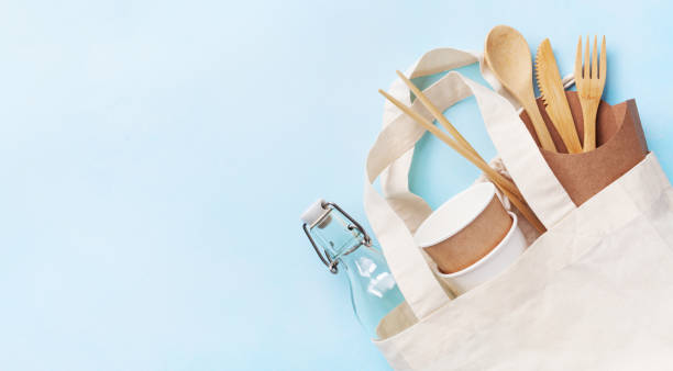 istock Organic cotton bag with glass jar and recycled tableware top view. Zero waste, eco friendly, plastic free concept. 1156523930
