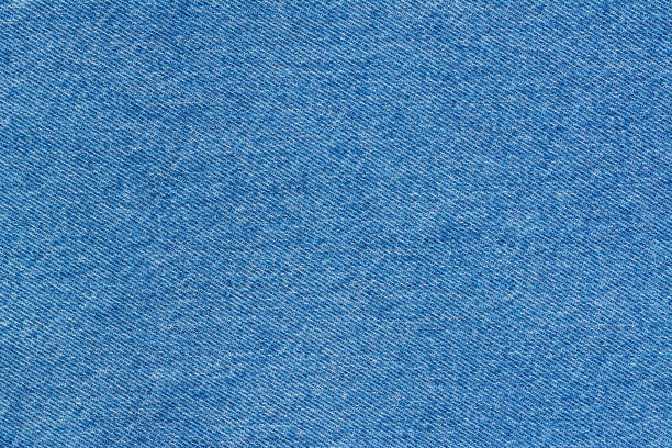 istock Jeans background denim pattern. Classic blue stonewashed fabric texture. Background of jeans canvas close up. 1156525051