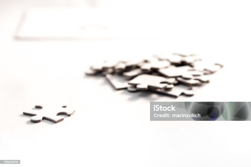 the rigth solution white jigsaw/puzzle whit one gap, symbol of problem solving Activity Stock Photo