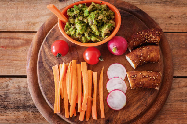 istock Healthy breakfast, raw vegetables with mash avocado and frozen yogurt 1156528478